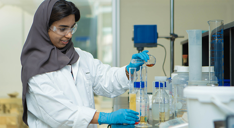 Photo of a woman chemist in the lab.
