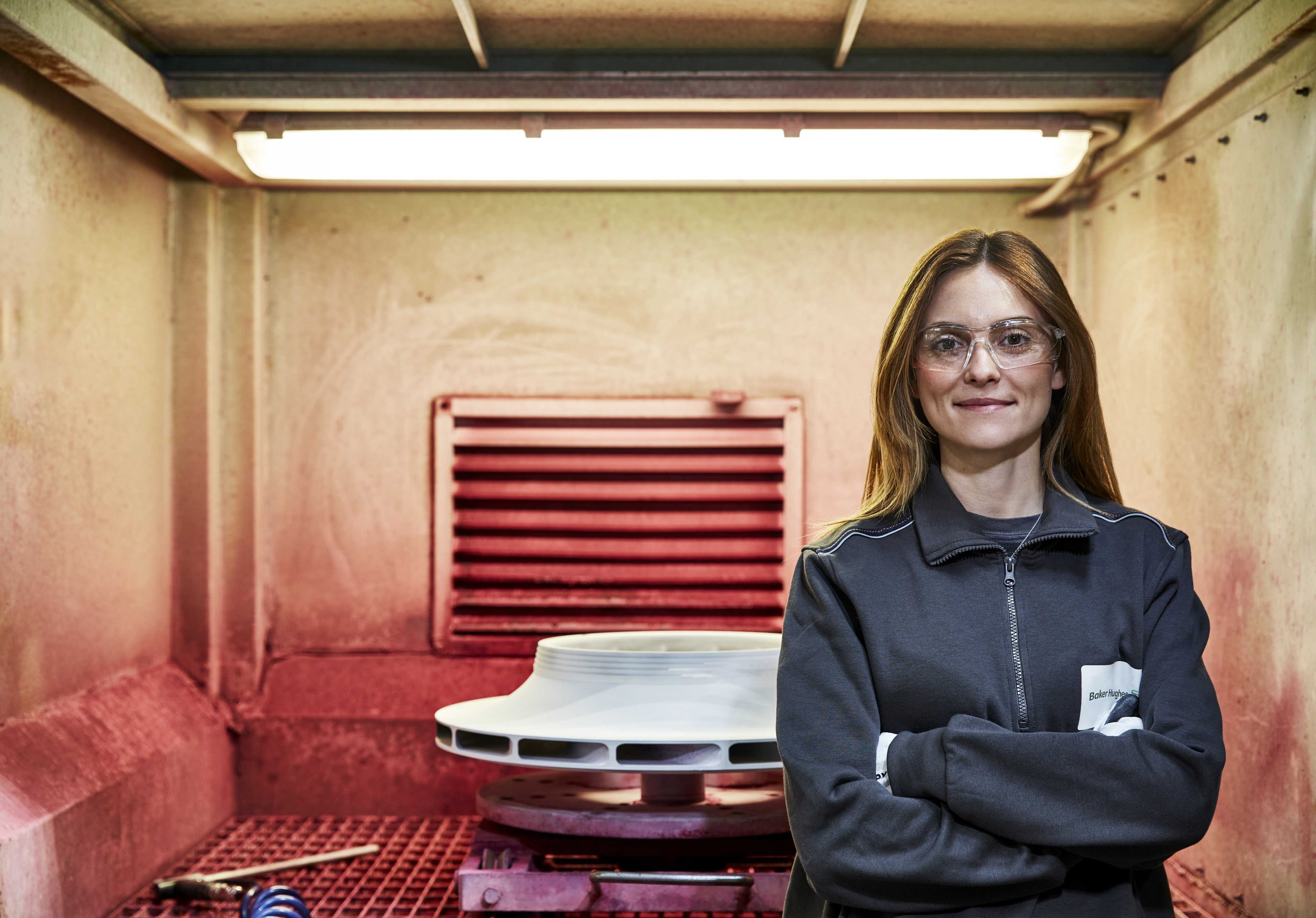 Baker Hughes employee working on a compressor impeller