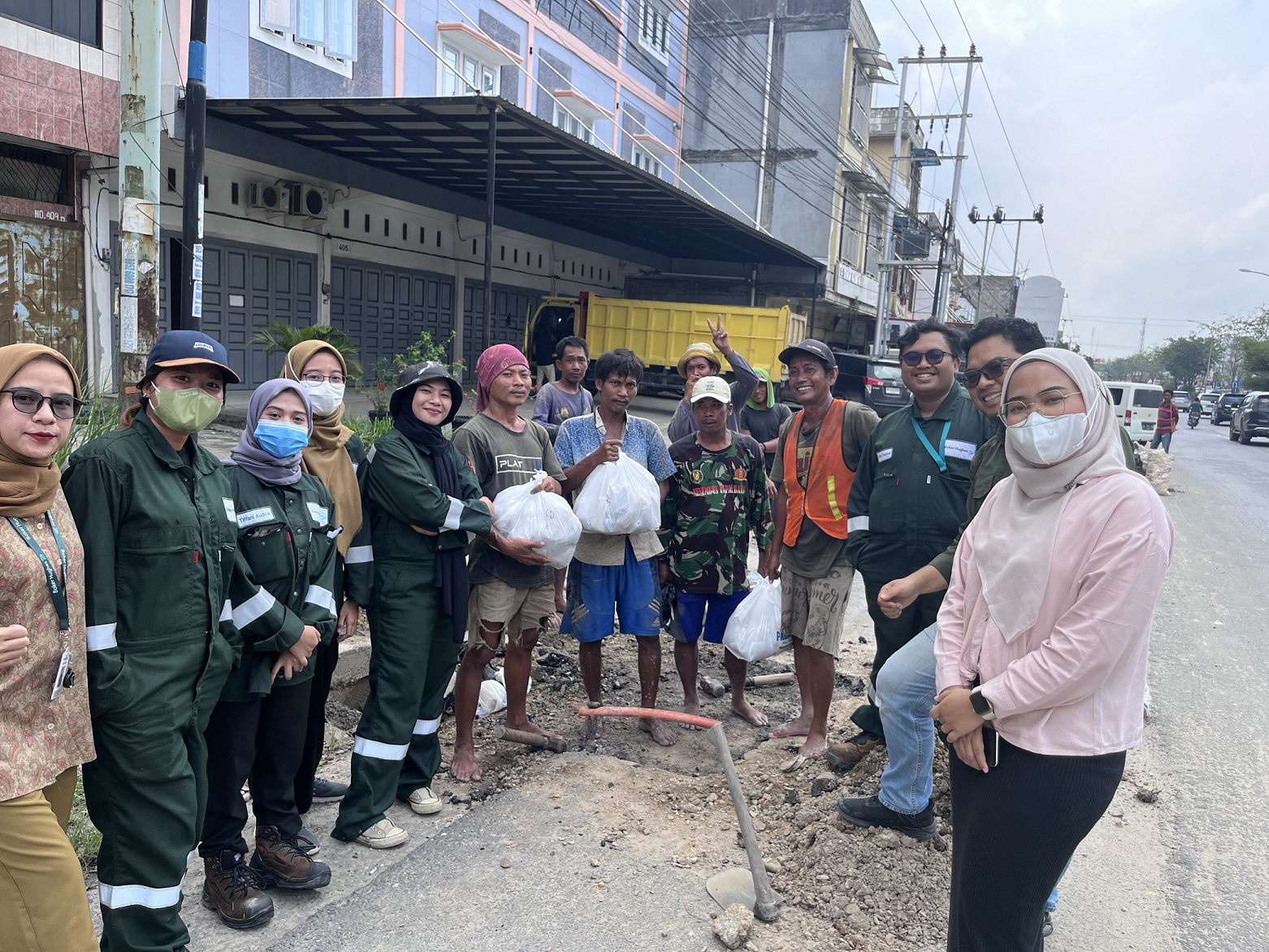 Team handing food in street