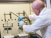 Photo of a chemist working in the lab.