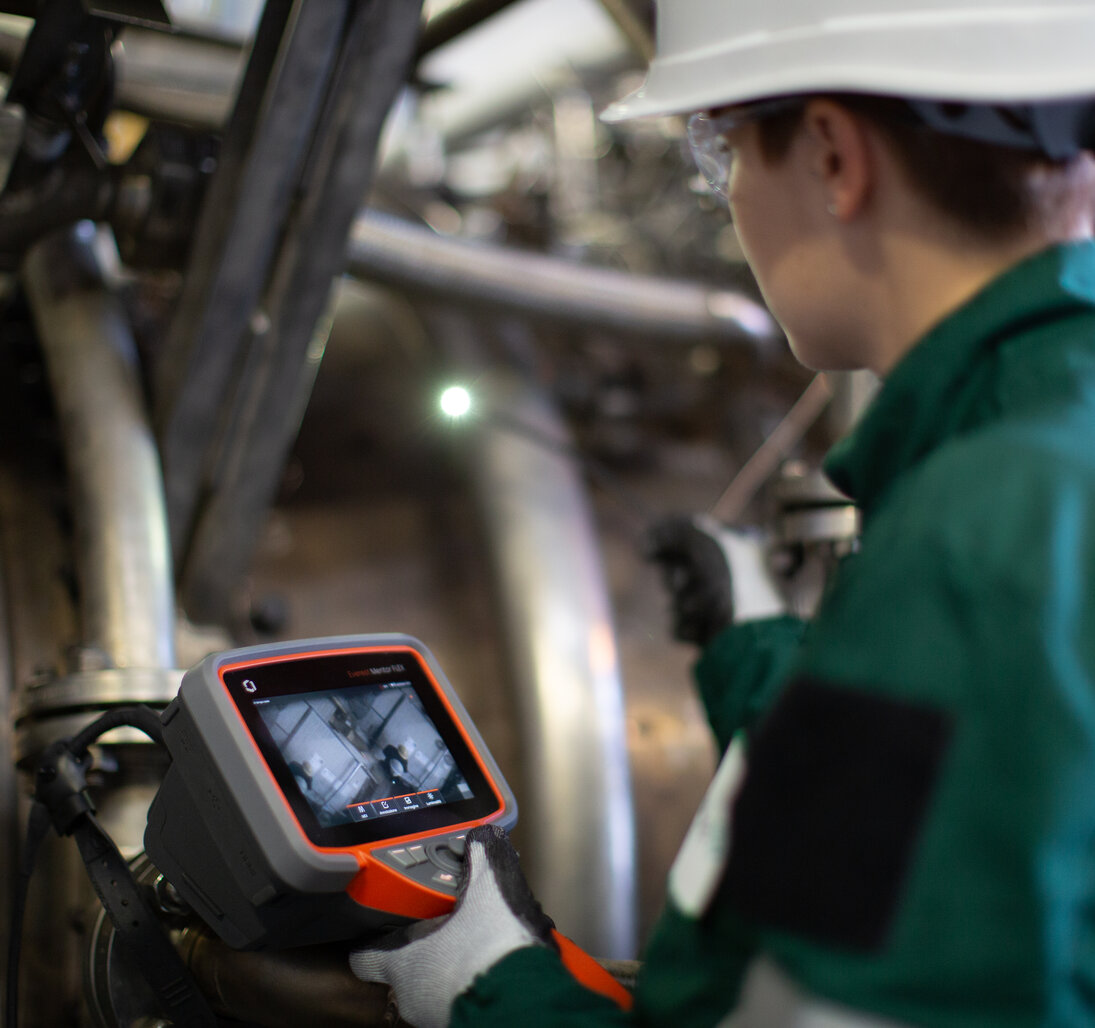 Video borescope managed equipment services repair person examining mentor flex video borescope.