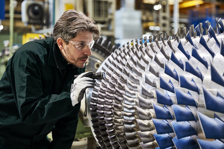 Baker Hughes Turbomachinery & Process Solutions engineer inspecting a NovaLT™ gas turbine​