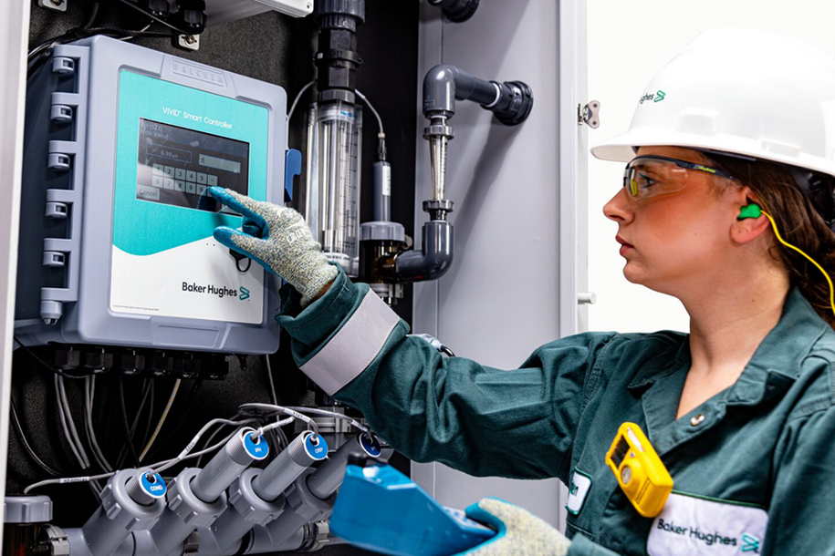 Photo of a person in the field using the VIVID smart controller.