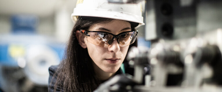 Woman operating machinery