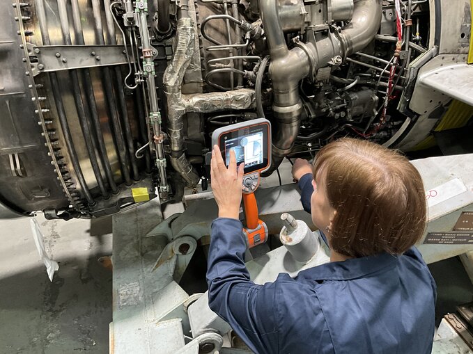 A technician servicing a mentor visual iq+ video probe.