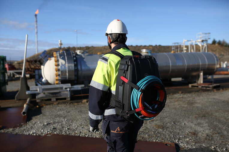 Technician wearing the portable Ca-Zoom HD transport case backpack with all equipment inside.