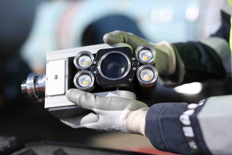 Inspector removing the Ca-Zoom HD ptz inspection camera head from the all-in-one transport case to assemble it for a nuclear inspection.