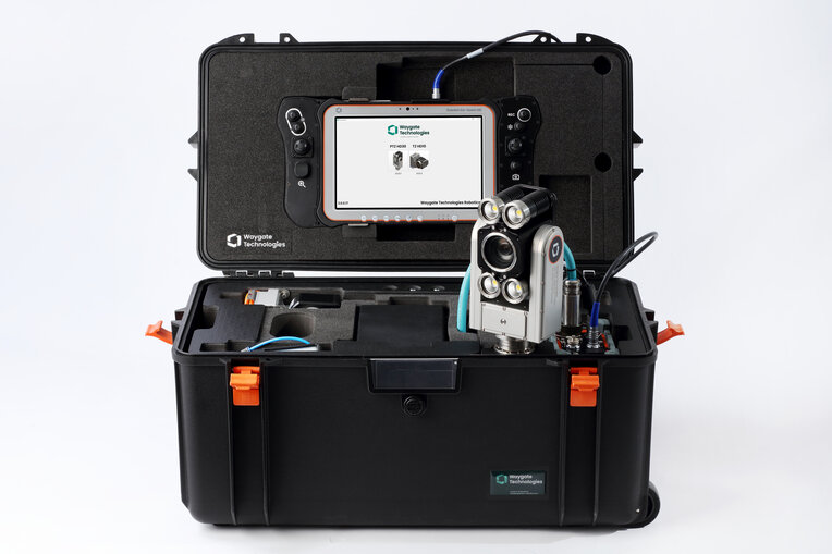 Up-close picture of Ca-zoom HD PTZ camera inside it's portable transport case. The case is open to show the control screen used to operate the camera head, and the packaged parts to the ptz inspection camera are visible.