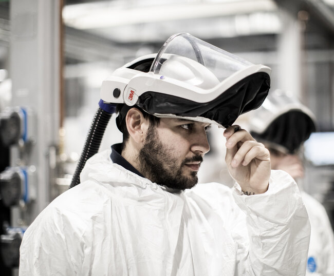 Photo of an employee wearing full protective gear at the additive labs in Florence