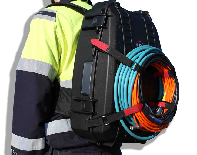close up image of ca-zoom hd inspection camera transport case as a backpack being worn by an inspector.