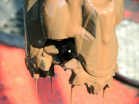 Photo of a drill bit with water-based drilling mud on it.