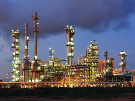 Photo of a refinery at night.