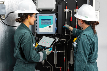 Two employees deploying TOPGUARD in the field.