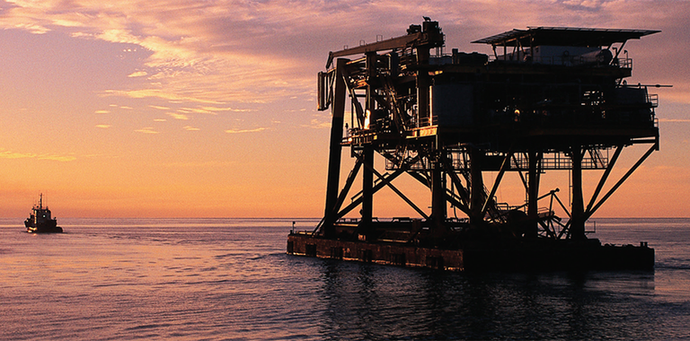 Photo of a decommissioned rig offshore.