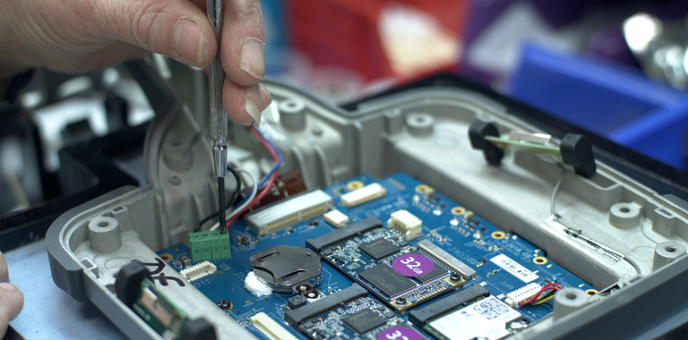 In-house video borescope repair process of fixing behind the screen of the MViQ videoprobe.