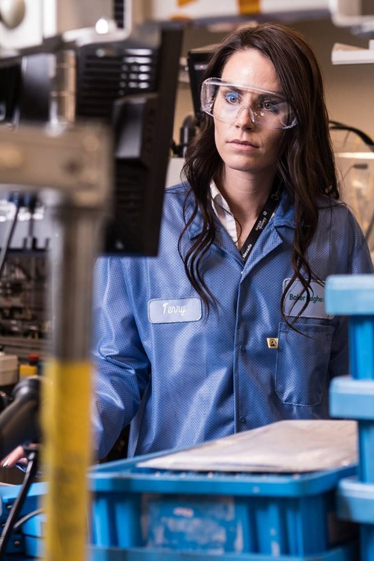Woman in coverall and safety glasses