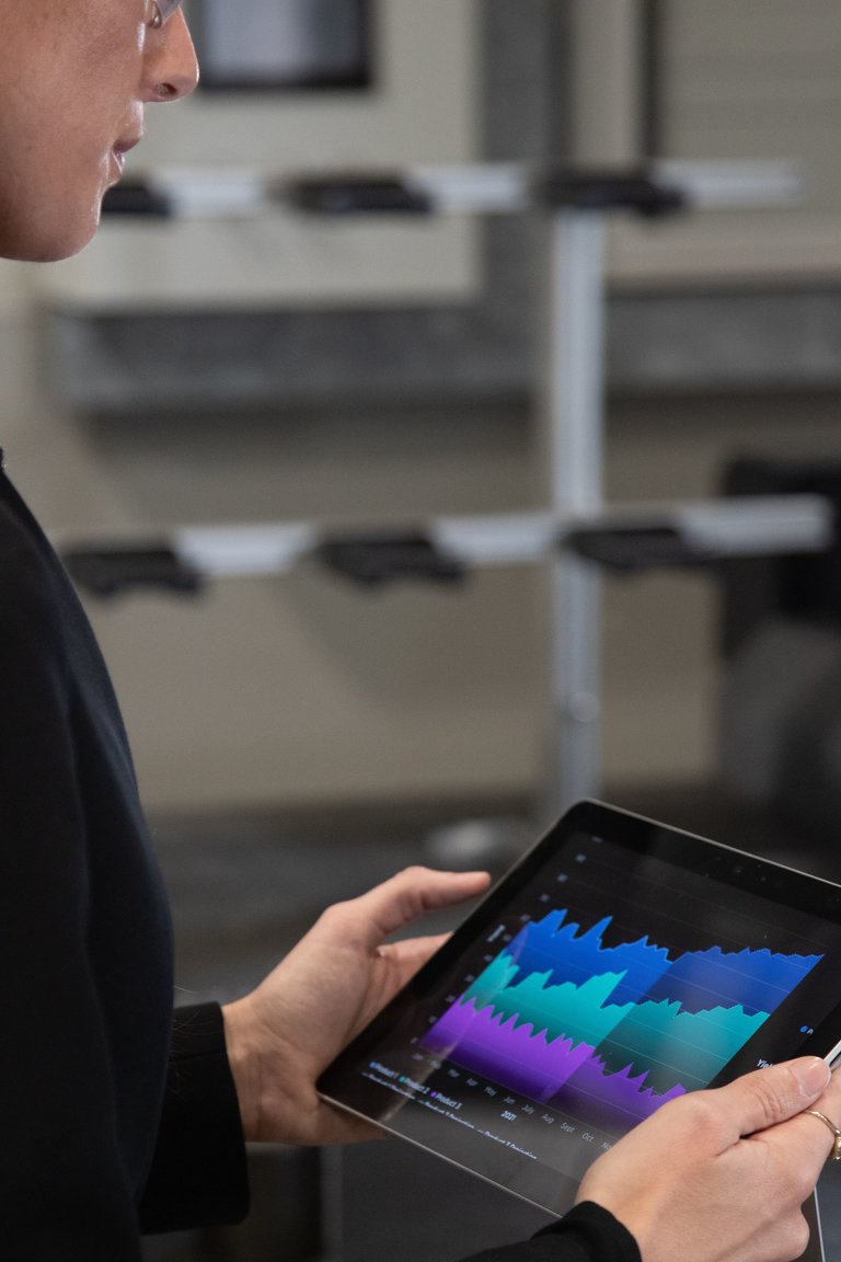 Woman looking at graph on tablet