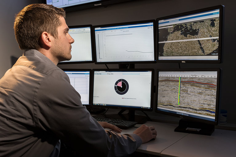 Male analyzing data on computer