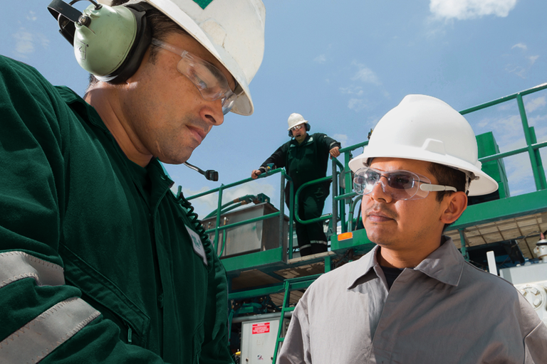 Photo of Baker Hughes engineer working in the field