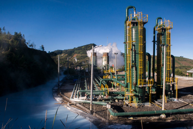 A refinery plant in the middle of green mountains